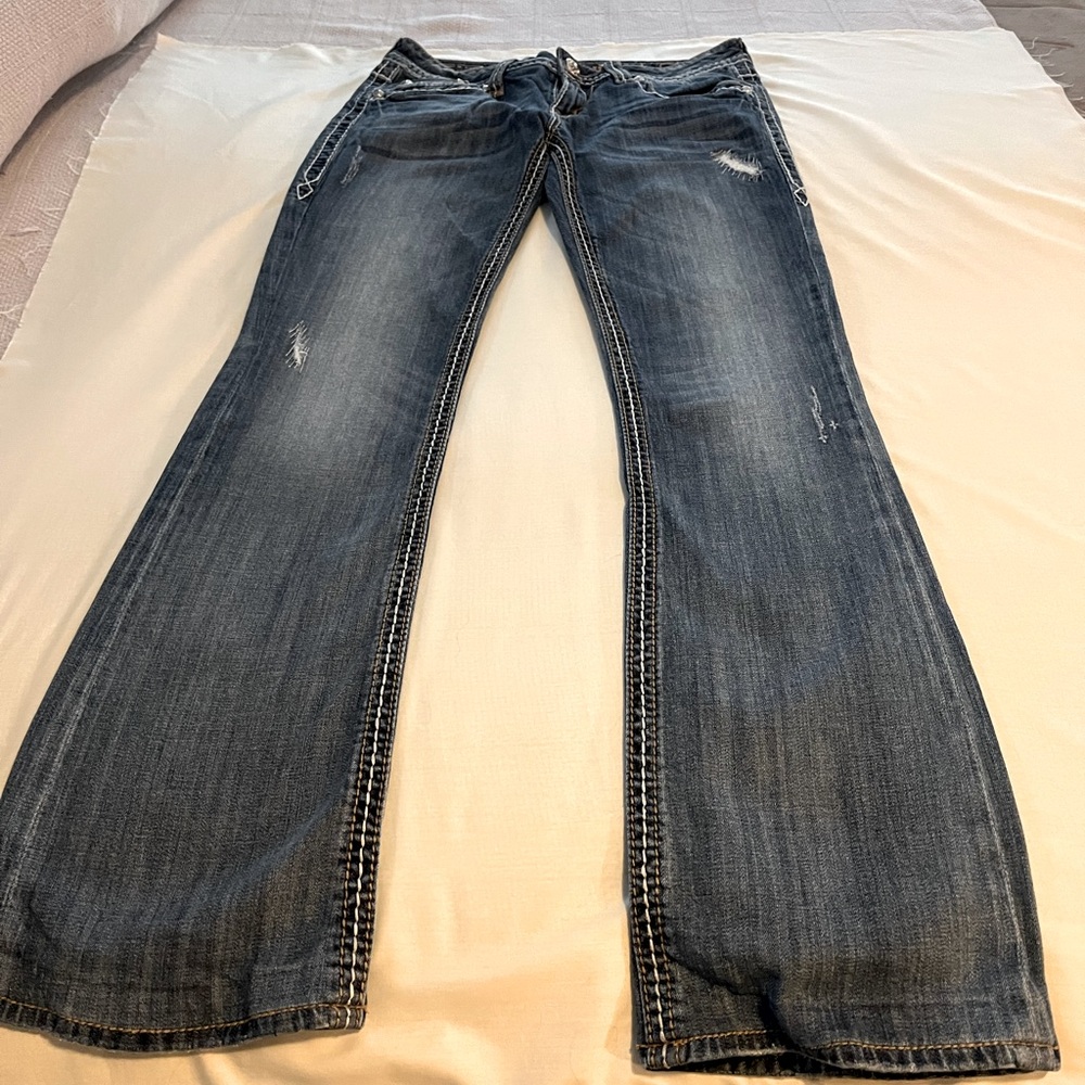 Rock revival Trisha boot cut jeans.  Detailed pockets & stitching.